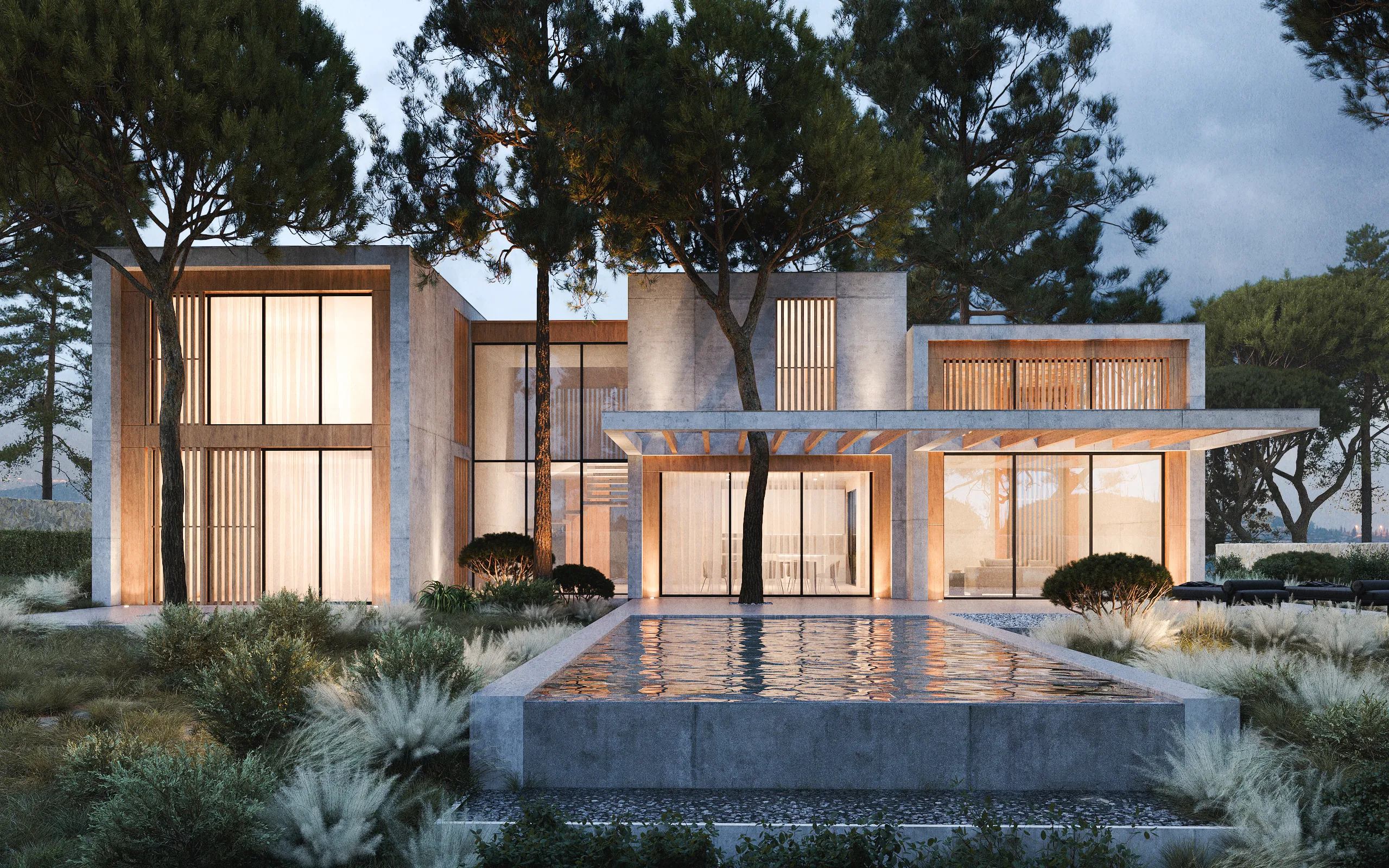 Vista frontal de la casa en Sant Andreu de Llavaneras, con una piscina infinita que refleja los pinos centenarios
