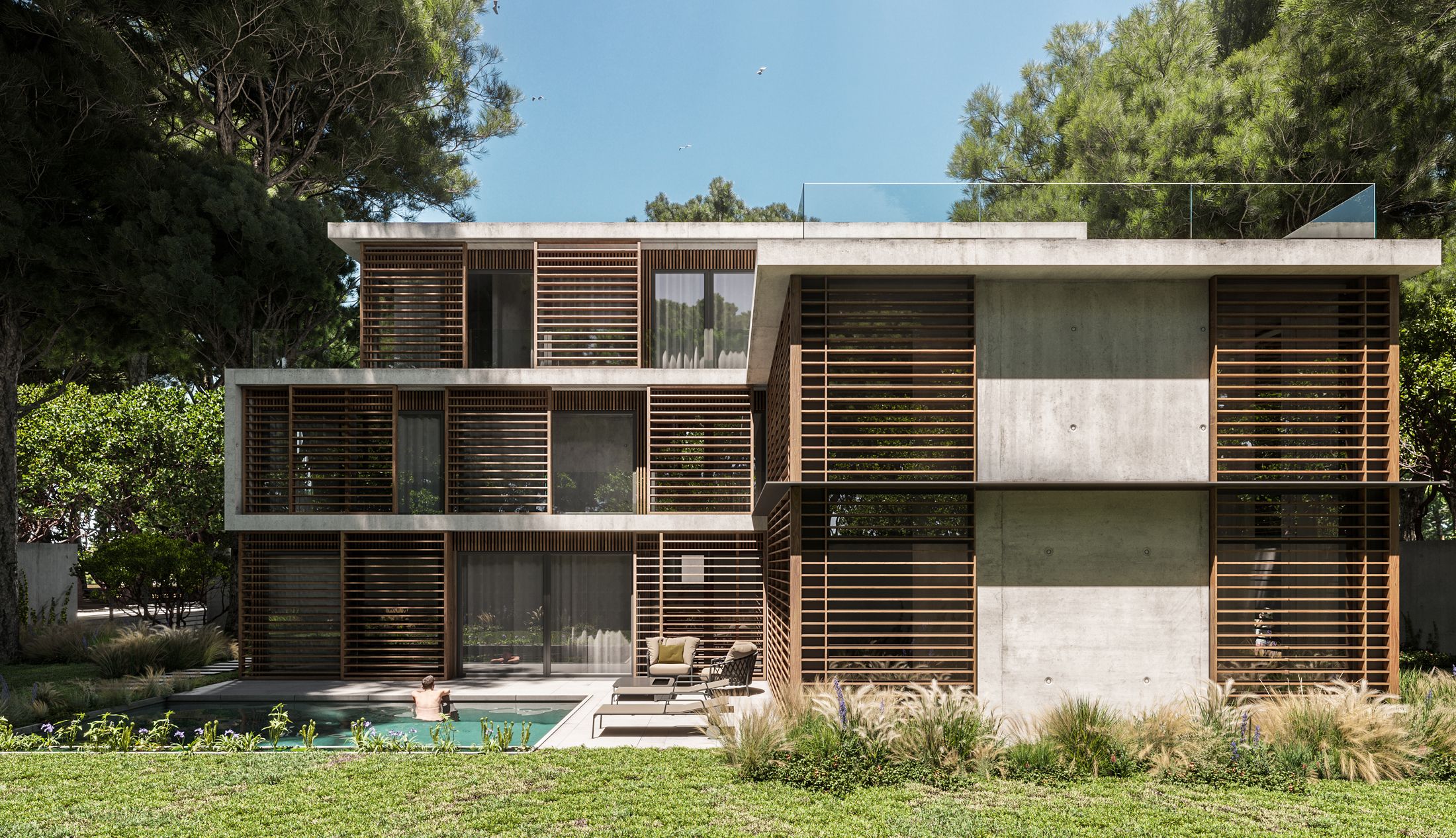 Front view of the concrete and wood villa rising among the dunes of Castelldefels