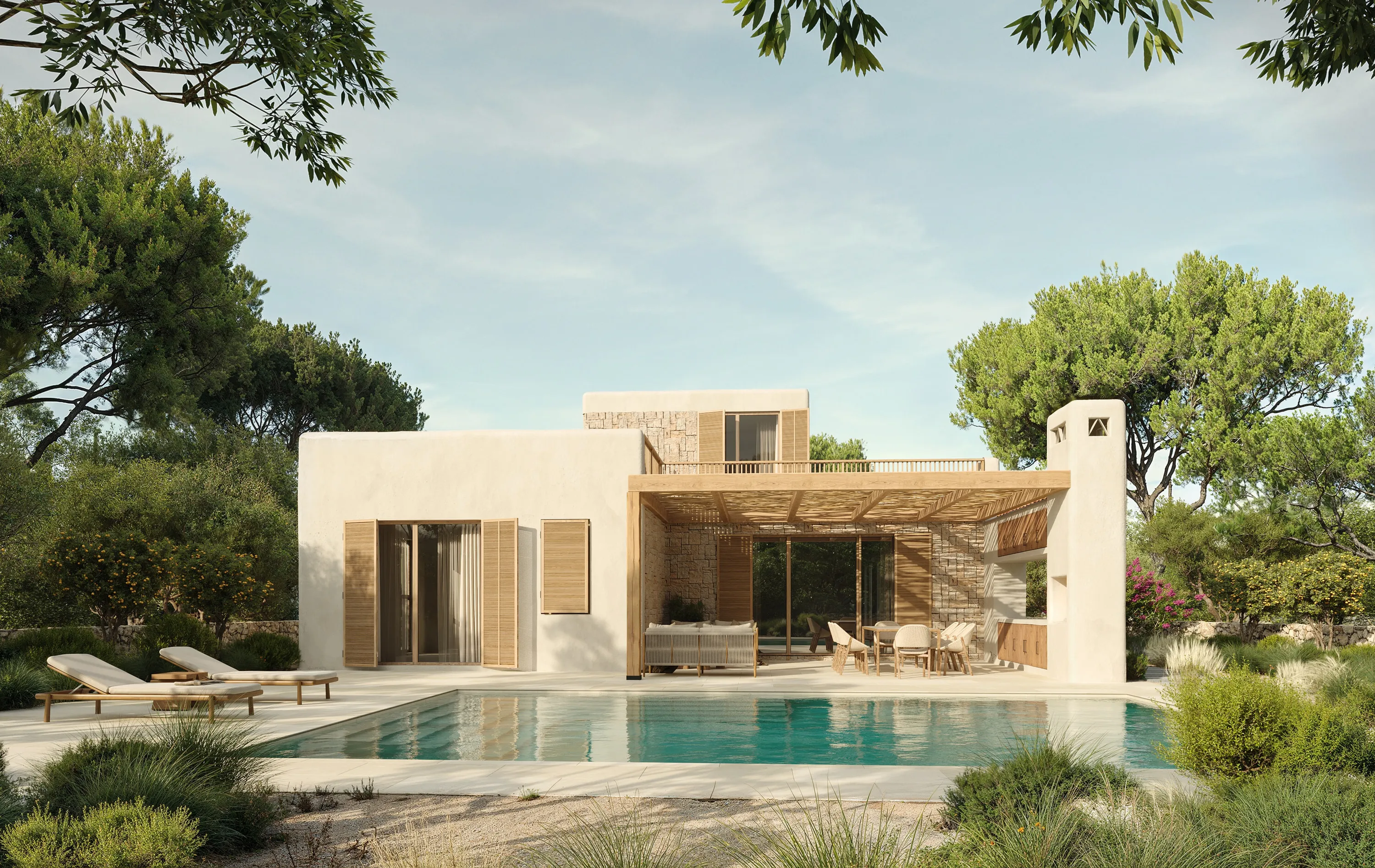 Villa mediterránea en l'Ametlla de Mar vista desde la piscina, con su fachada principal elevándose entre los pinos