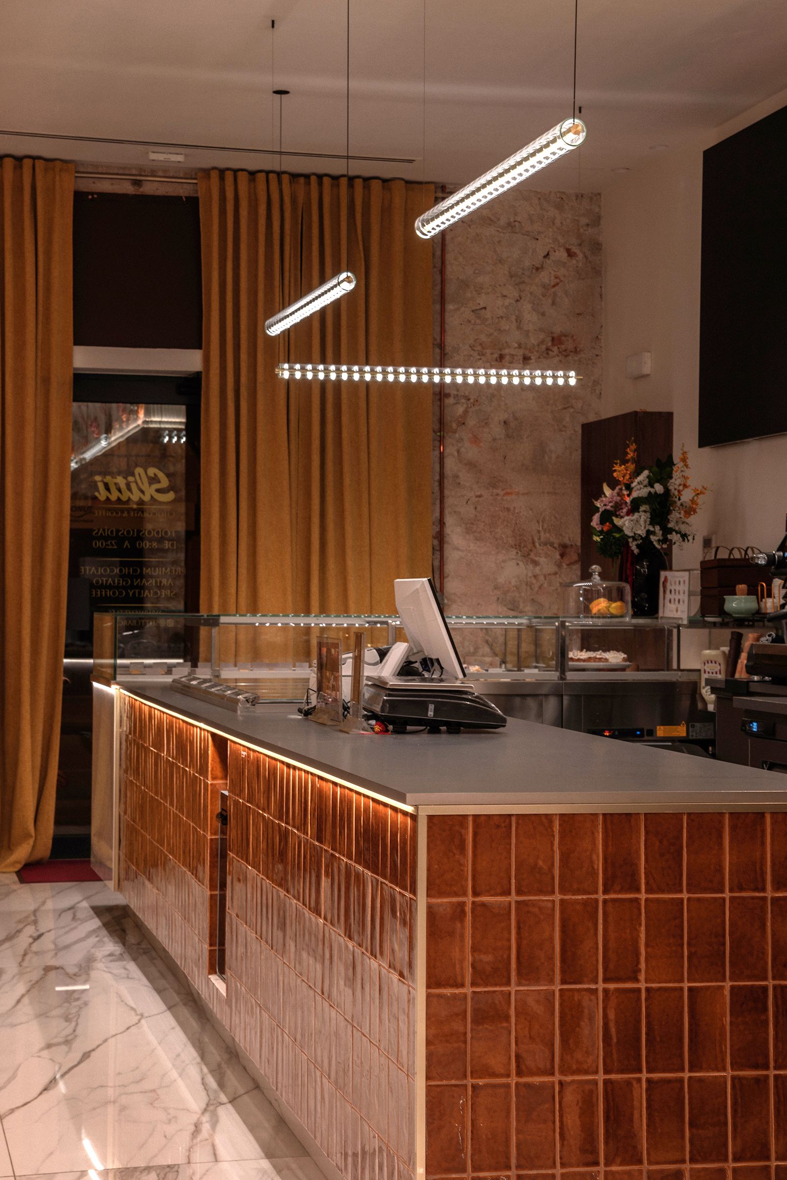 Counter area with the warm, layered palette of the project