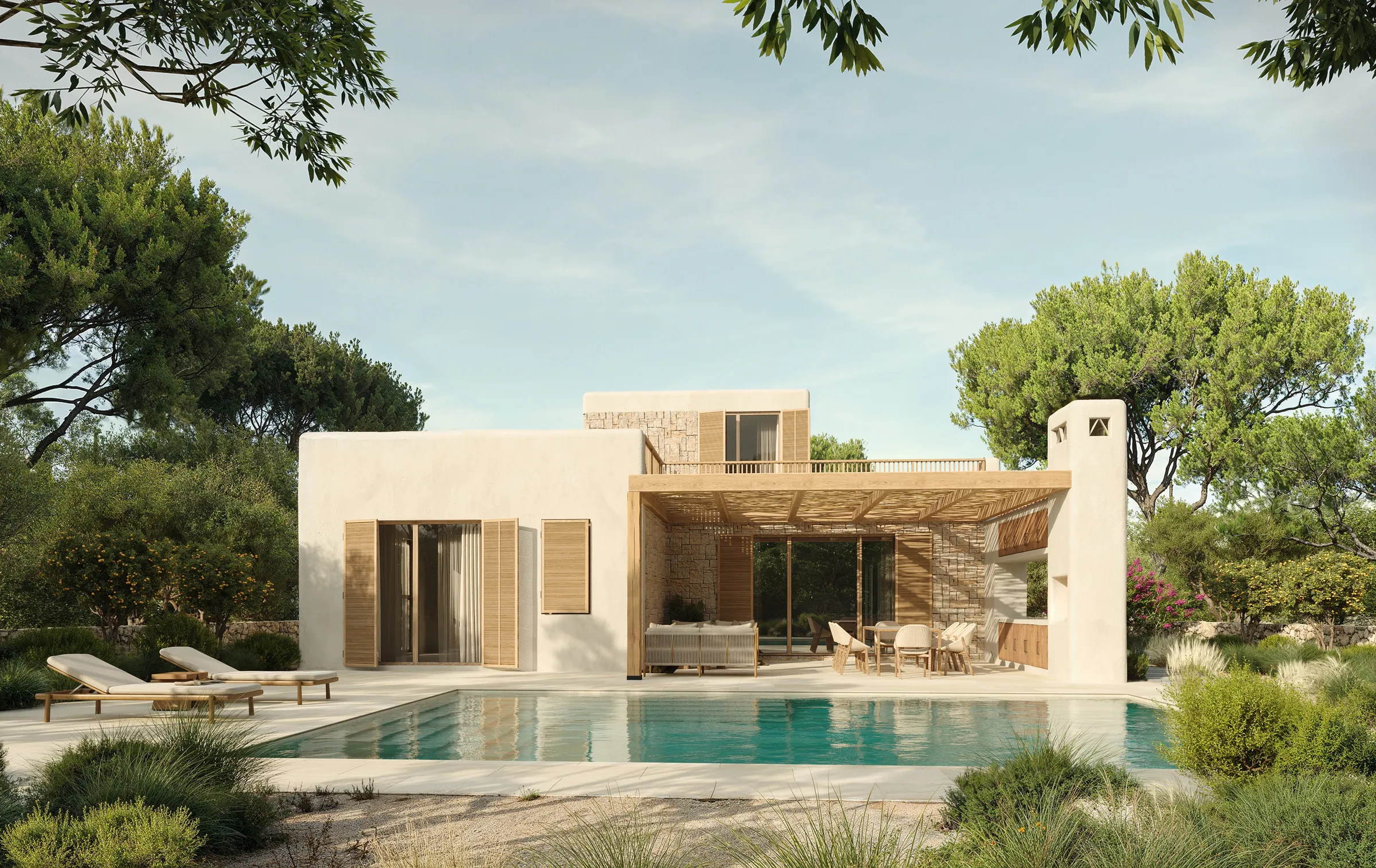 La villa vista desde el jardín, rodeada de vegetación mediterránea autóctona