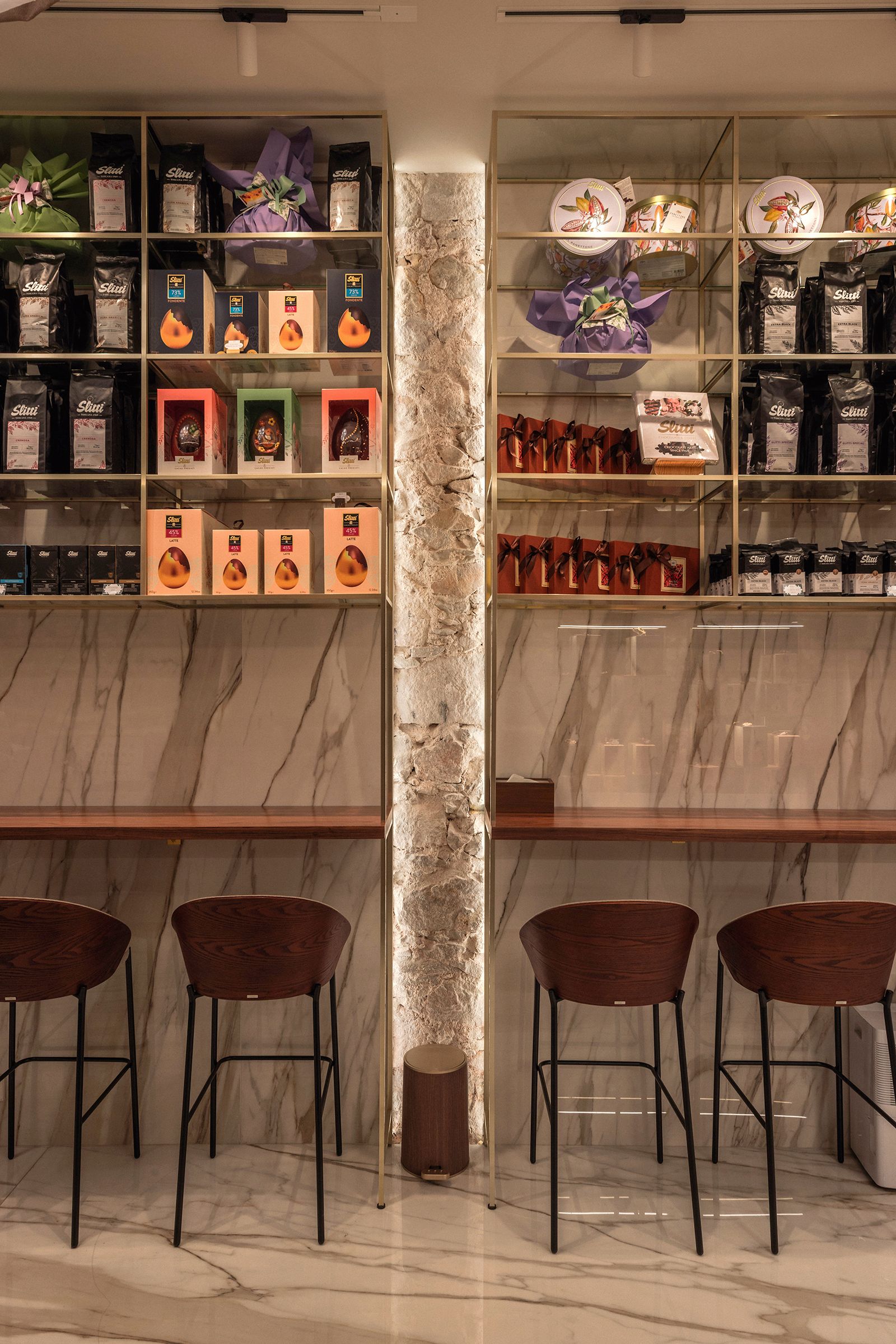 Shelves with a high tasting bar in front